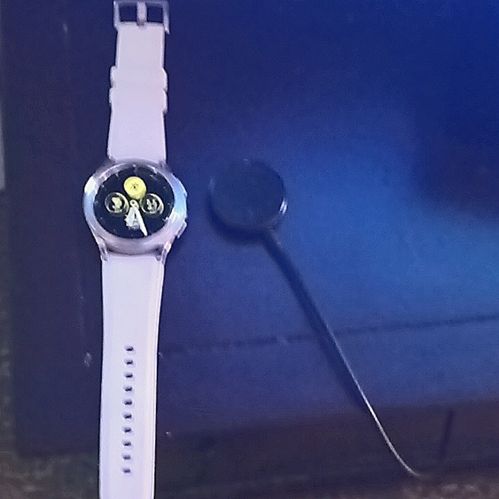 Stainless steel Samsung Galaxy smart watch with white band, stainless clasp